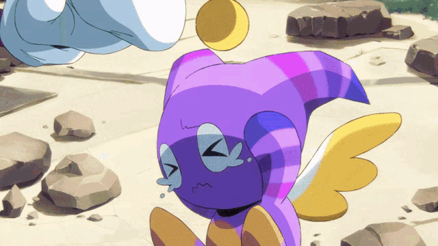a purple and yellow cartoon character with wings and a tear running down its face