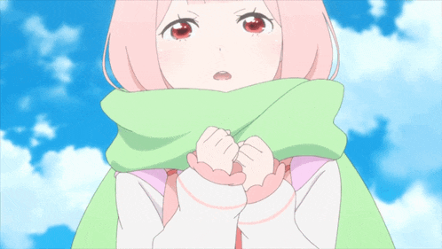 a girl with pink hair is wearing a green scarf