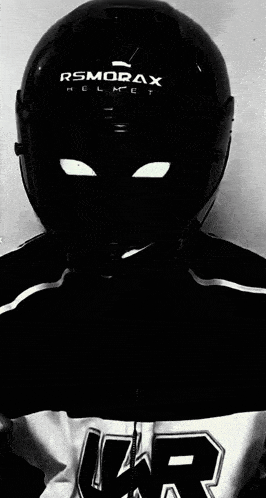 a person wearing a helmet that says rsmorax helmet on it