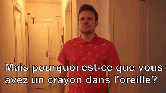a man in a red shirt with the words mais pourquoi est-ce que vous