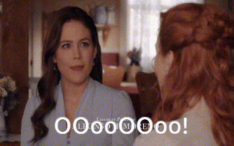 two women are sitting next to each other in a living room and one of them is saying ' because i met you ' .