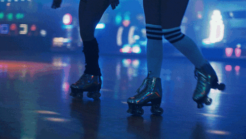 a person wearing roller skates and knee high socks is dancing