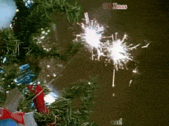 a christmas tree with sparklers on it and a red white and blue star