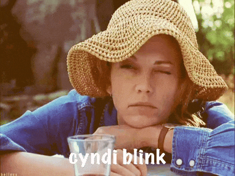 a woman wearing a straw hat is holding a shot glass with the words cyndi blink written below her