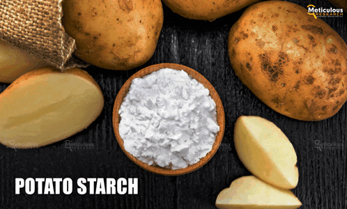 a bowl of potato starch sits on a table with potatoes