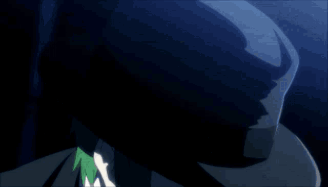 a man with green hair and a black hat