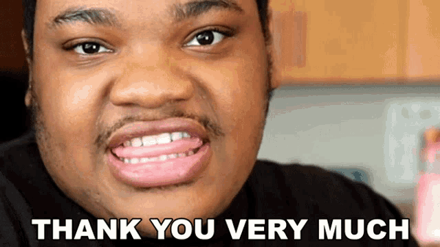 a man with his tongue sticking out and the words thank you very much below him