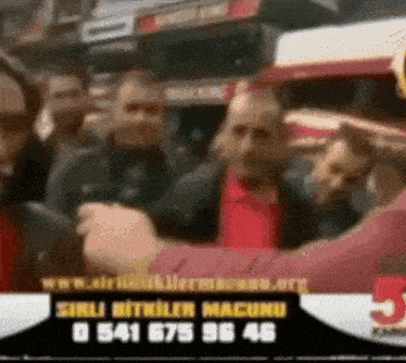 a blurred image of a group of people with the number 05416875946 on the bottom