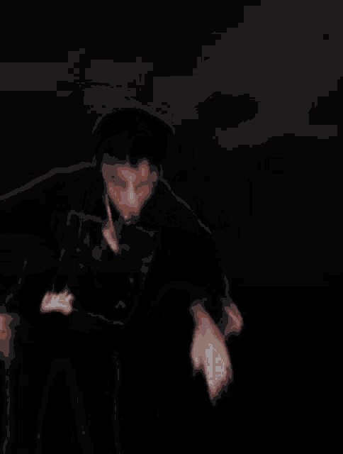 a blurry picture of a person in a dark room with a name tag that says ' a ' on it