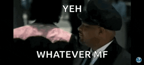 a man in a suit and hat says yeah whatever mf