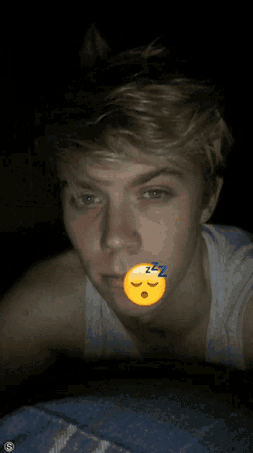 a sleeping emoji with the letters zzz on it