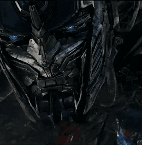 a close up of a robot face with blue eyes