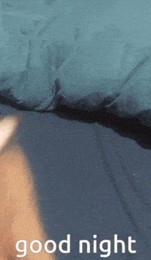 a picture of a person laying on a bed with the words good night on the bottom