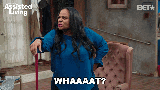 a woman is holding a mop and says whaaat