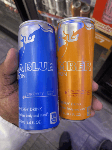 a blue and orange can of energy drinks