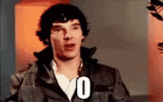 a man in a leather jacket is making a funny face and holding a sign that says 0 .