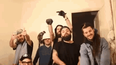 a group of bearded men are posing for a picture