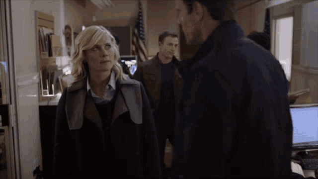 a man and a woman are standing next to each other