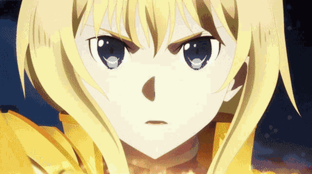a girl with blonde hair and blue eyes is looking at the camera with an angry look on her face