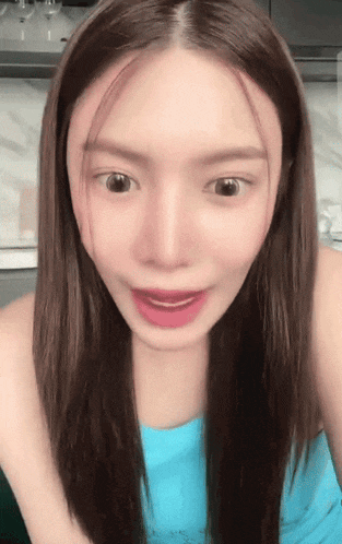 a close up of a woman 's face with long hair