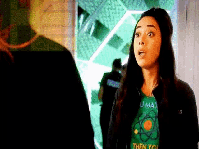 a woman is wearing a green t-shirt that says `` then you '' .