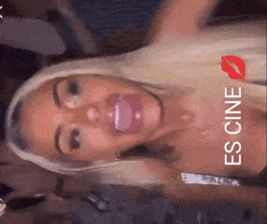 a close up of a woman 's face with the words " es cine " on the bottom