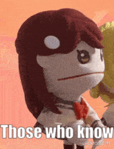 a stuffed animal with red hair and the words `` those who know '' written on it .