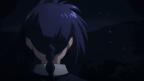a person 's head is shown in the dark with the letter n visible