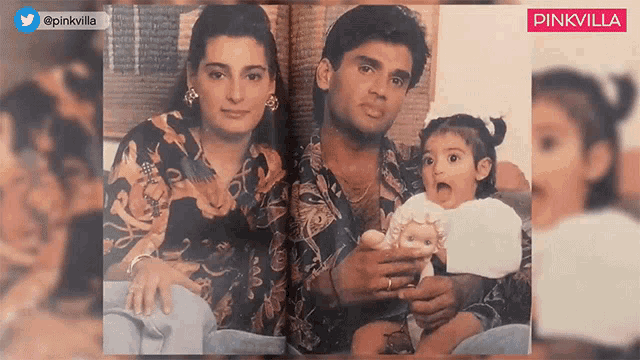 a man and a woman are holding a baby doll in a photo .