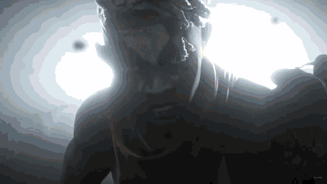 a statue of a man with white paint on his face is shown in the dark