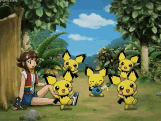 a girl is sitting on the ground with a bunch of yellow pokemon around her