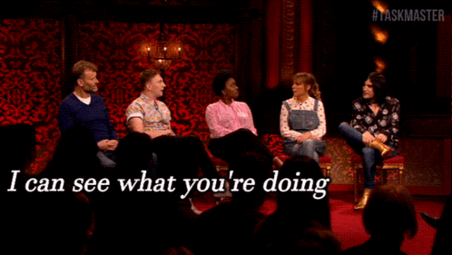 a group of people sitting around a table with the words " i can see what you 're doing " on the bottom