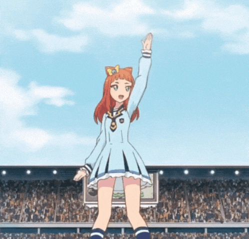 a girl in a blue dress stands in front of a crowd with her arms in the air