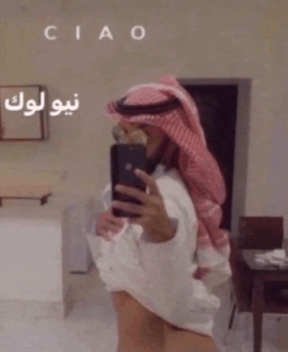 a man is taking a picture of himself with ciao written on the bottom