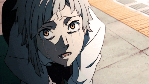 a close up of a person 's face with tears coming out of it