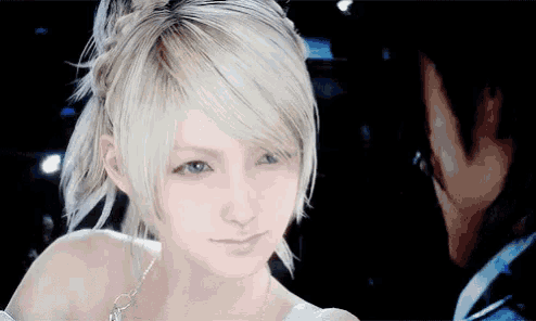 a woman with blonde hair is looking at a man