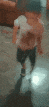 a blurred image of a child walking on a floor