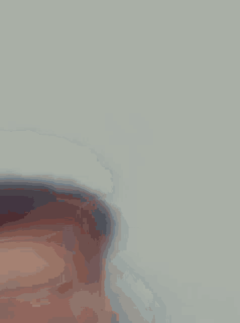 a blurred image of a person 's feet with a white background