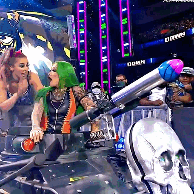 a woman with green hair is sitting in a tank with a skull on the side