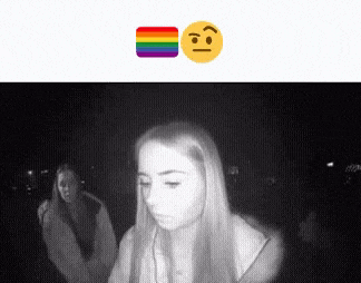 a woman 's face is visible in a black and white photo with a rainbow emoji .