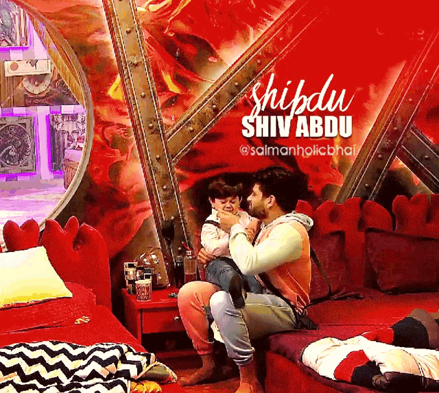 a man sitting on a couch holding a child with the name shiva abu on the bottom