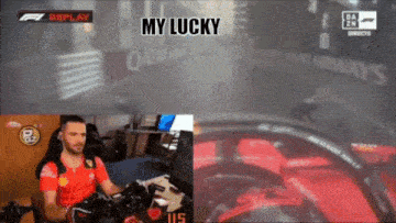 a man sitting in front of a computer with the words " my lucky " on the bottom