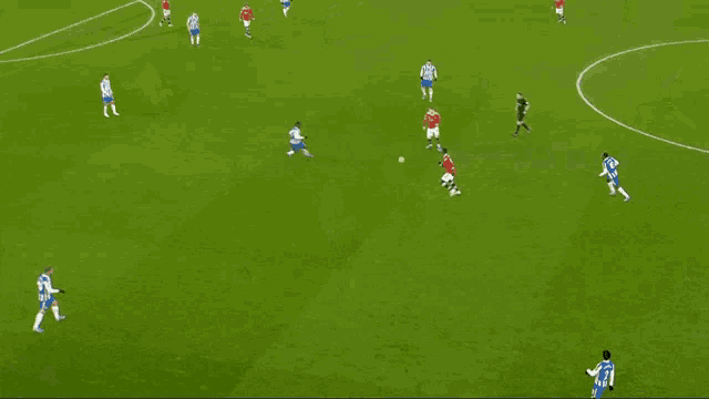 a soccer player with the number 27 on his jersey kicks the ball