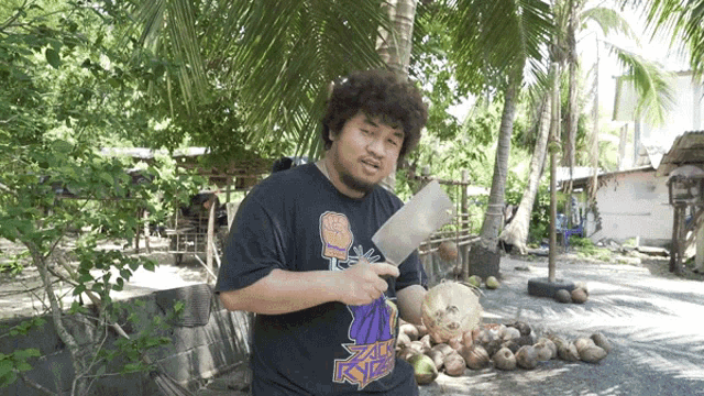 a man is holding a knife and wearing a shirt that says xlr