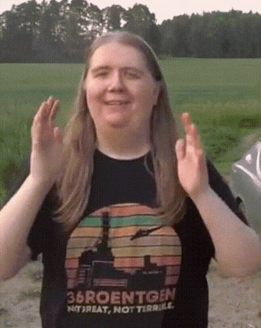 a woman wearing a t-shirt that says 38roentgen on it