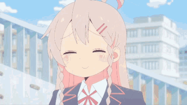 a girl in a school uniform is smiling and making a funny face