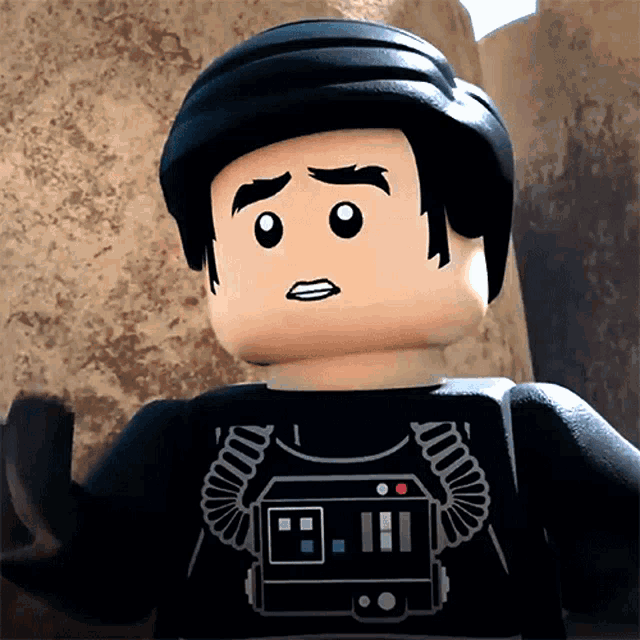 a close up of a lego figure with a black helmet