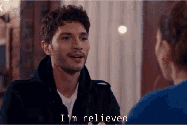 a man and a woman are talking to each other and the man is saying `` i 'm relieved ''