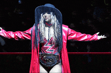 a woman in a wrestling ring with a belt that says ' n ' on it