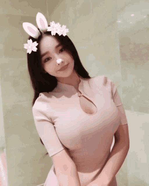 a woman wearing bunny ears and flowers on her hair